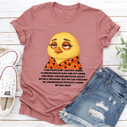 I See People My Age Out There Climbing Mountains And Zip Lining And Here Tee